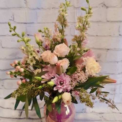 Pink and white mixed bouquet in a pink vase