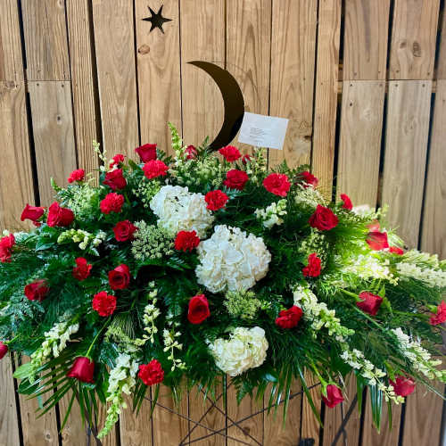 Large red and white floral spray with roses and carnations