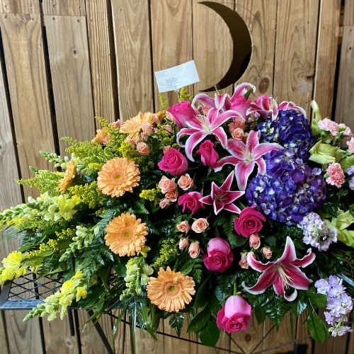 Large mixed floral spray with lilies, roses, hydrangeas, and gerbera daisies