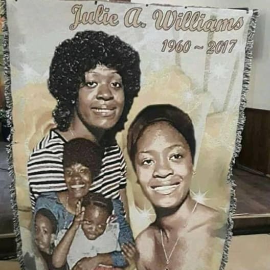 Memorial blanket with a portrait collage and the name Julie A. Williams
