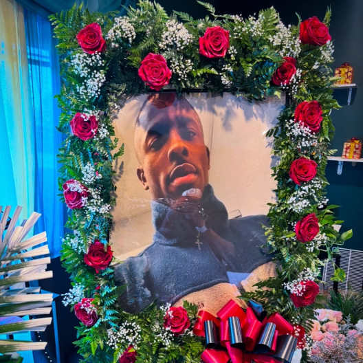 Large floral frame with red roses around a portrait photo