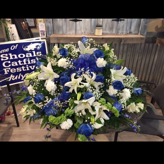 Large blue and white floral spray with lilies and roses