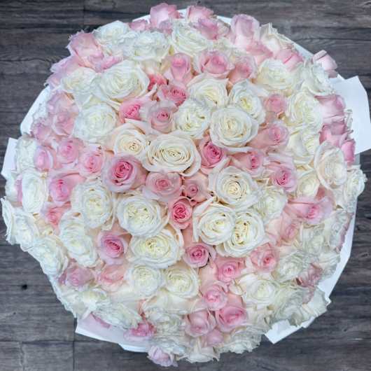 Round bouquet of white and pale pink roses