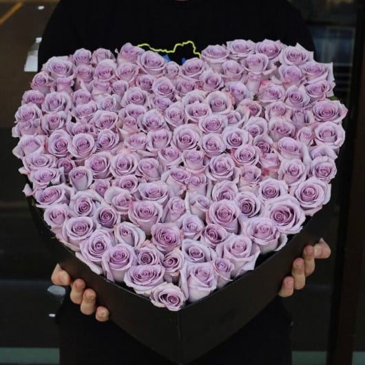 Heart-shaped box filled with lavender roses