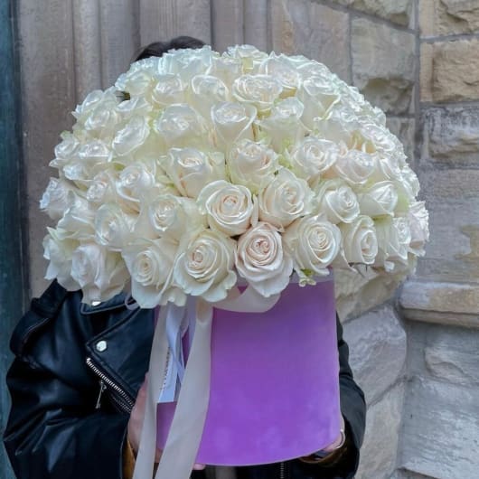 Large bouquet of white roses in a lavender hatbox with ribbon