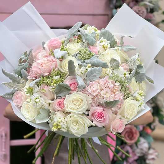 Bouquet of pink and white roses with pale filler flowers