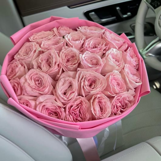 Bouquet of pink roses wrapped in pink paper