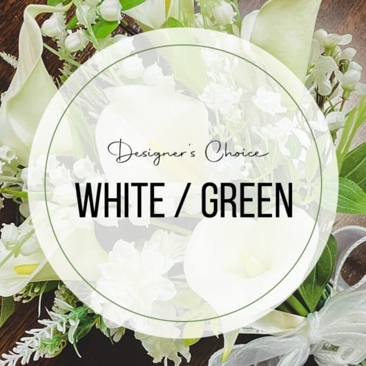 White and green floral arrangement with calla lilies and small white blooms