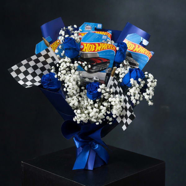 Bouquet with blue roses, baby's breath, and Hot Wheels packages