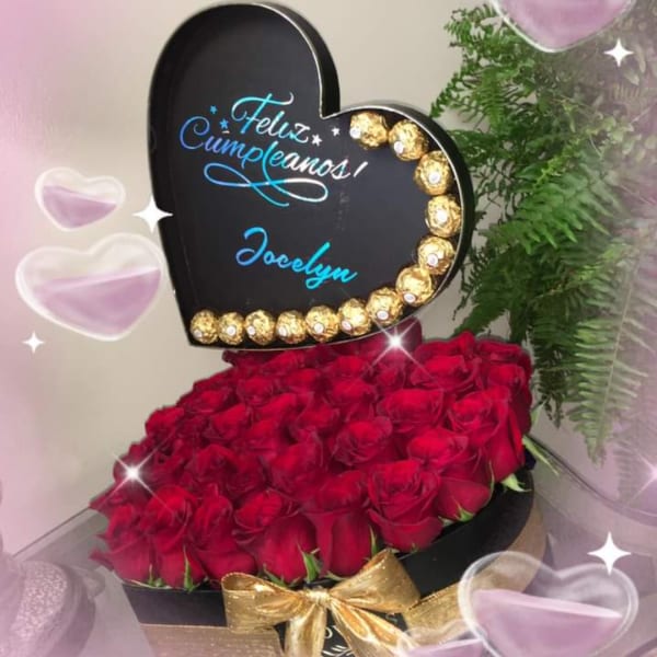 Heart-shaped box of red roses with a birthday sign