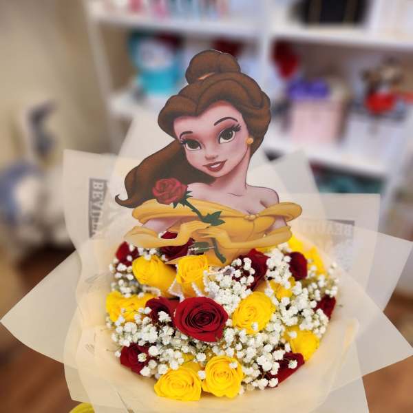 Bouquet of red and yellow roses with a princess topper