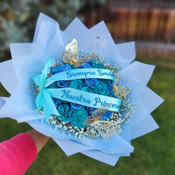 Blue rose bouquet with butterfly decorations and ribbon