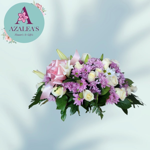 Pink and white flower bouquet with a satin ribbon