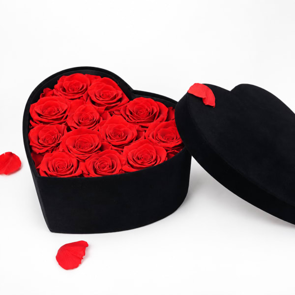 Heart-shaped black box filled with red roses
