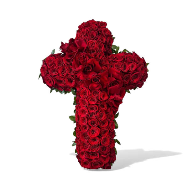 Cross-shaped arrangement of red roses on a white background