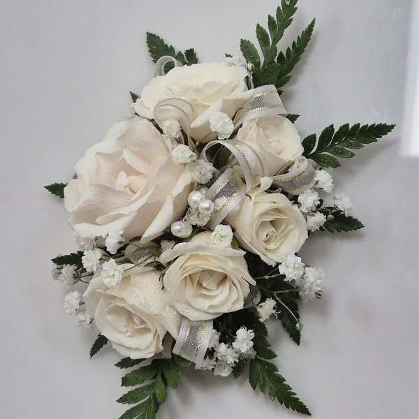 Cream rose bouquet with white filler flowers and ribbon accents