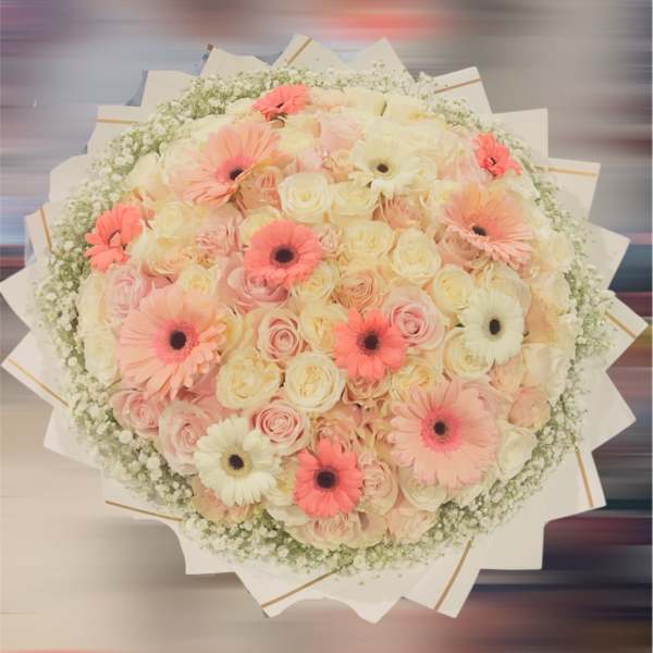 Large bouquet of pink and cream roses with gerbera daisies