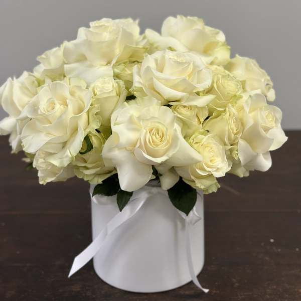 White rose bouquet in a white round box with ribbon