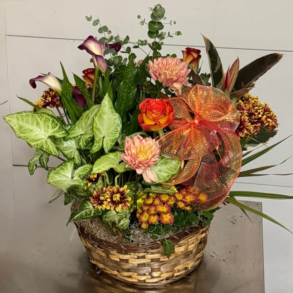 Mixed floral basket with calla lilies, roses, and chrysanthemums