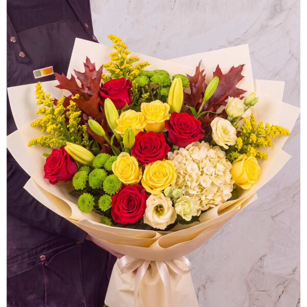 Bouquet of red and yellow roses with white hydrangea and green button mums
