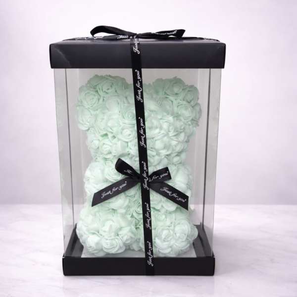 Mint rose-shaped teddy bear in a clear gift box with black ribbon