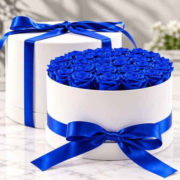 Blue roses in a white round box with a satin ribbon