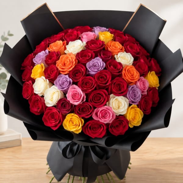 Bouquet of multicolored roses wrapped in black paper