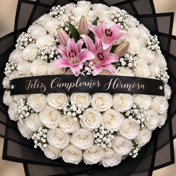 White rose and pink lily bouquet with a birthday ribbon