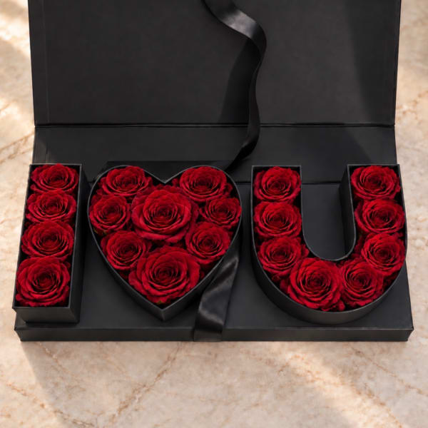 Red roses arranged in black boxes spelling "I LOVE U"