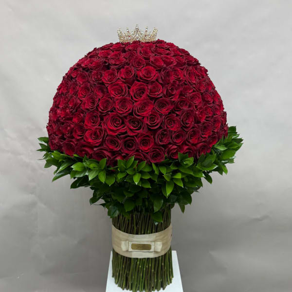 Large dome of red roses topped with a small crown