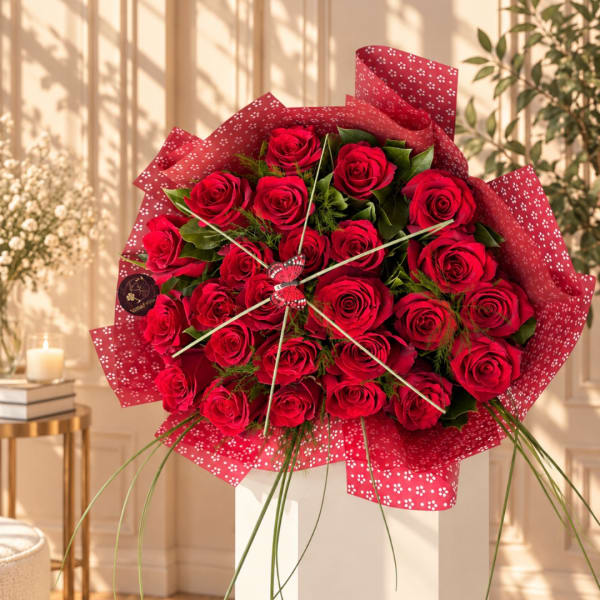 Bouquet of red roses wrapped in patterned red paper