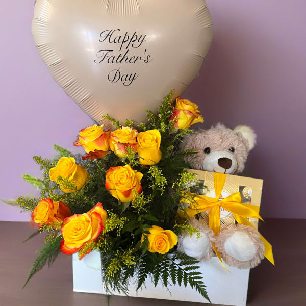 Yellow roses with a heart-shaped Father’s Day balloon and teddy bear gift box