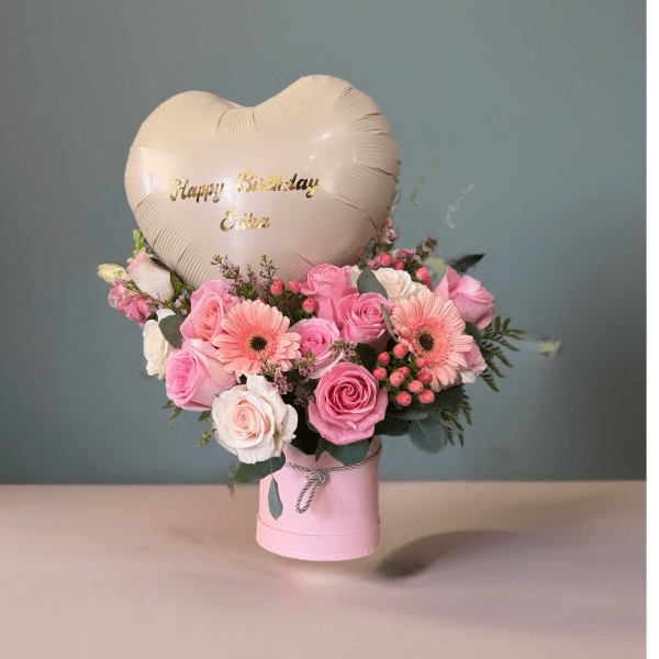 Pink rose bouquet with gerbera daisies and a heart balloon in a pink box