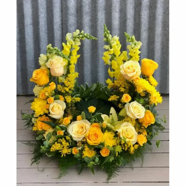 Yellow and cream rose wreath with mixed yellow flowers