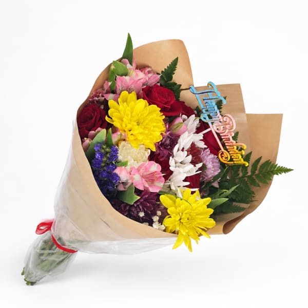 Mixed bouquet with roses, chrysanthemums, and alstroemeria wrapped in brown paper