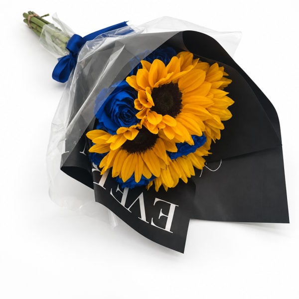 Bouquet of yellow sunflowers and blue roses wrapped in black paper