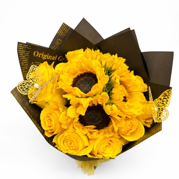 Yellow sunflower and rose bouquet wrapped in black paper with butterfly accents