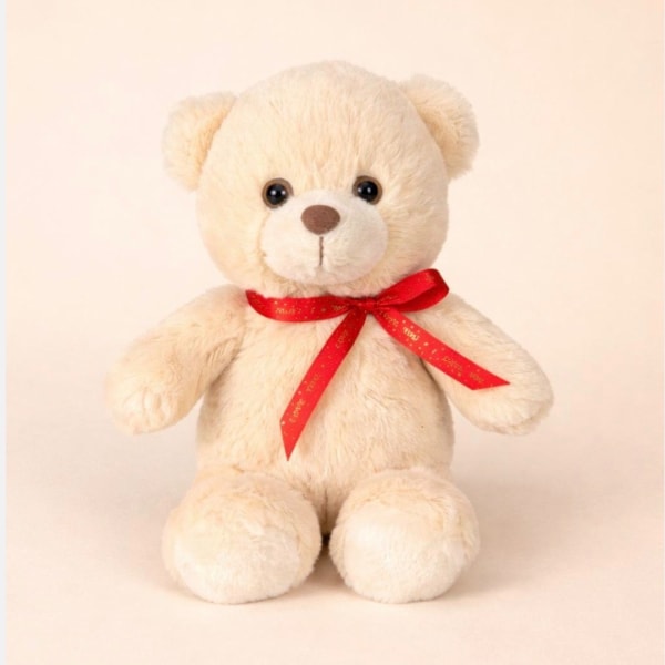 Cream teddy bear with a red ribbon bow on a plain background