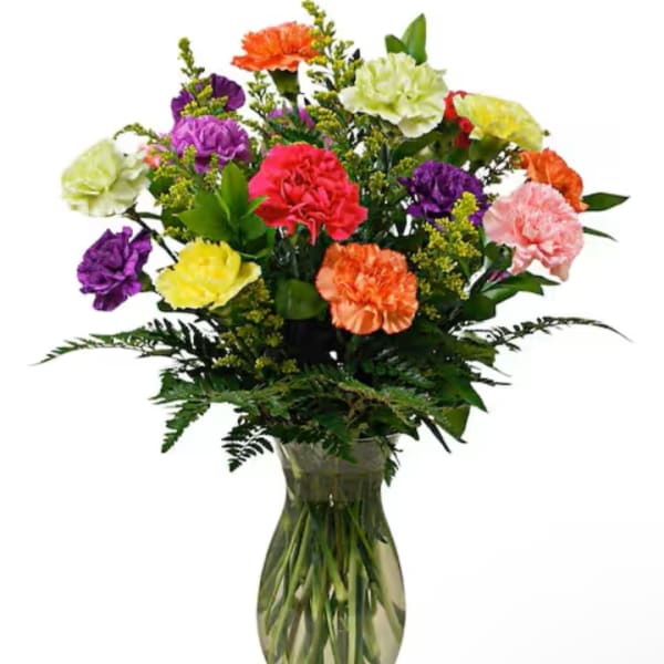 Colorful mixed carnation bouquet in a clear glass vase