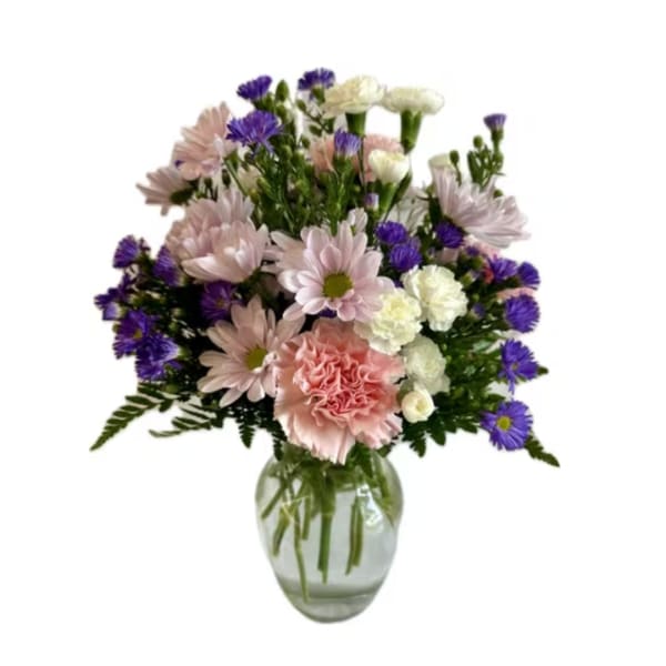 Pink and purple mixed bouquet in a clear glass vase