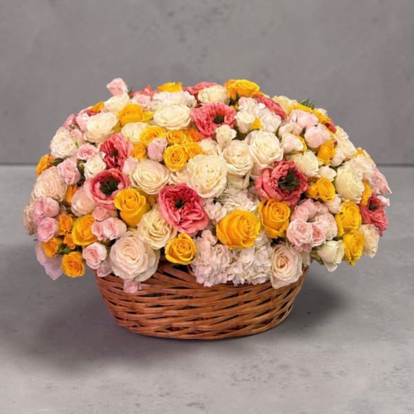 Basket of pink, white, and yellow roses