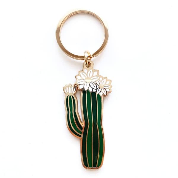 Cactus-shaped keychain with white flower accents