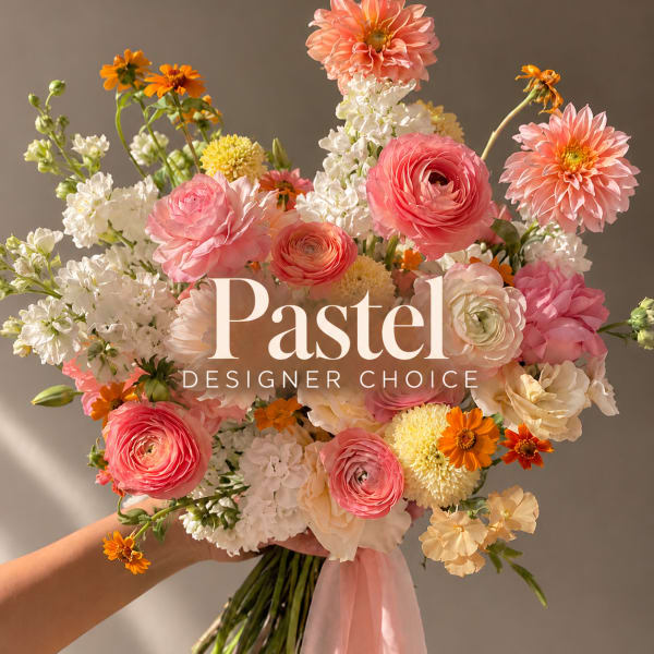 Handheld bouquet of pink, white, and orange flowers with a pink ribbon