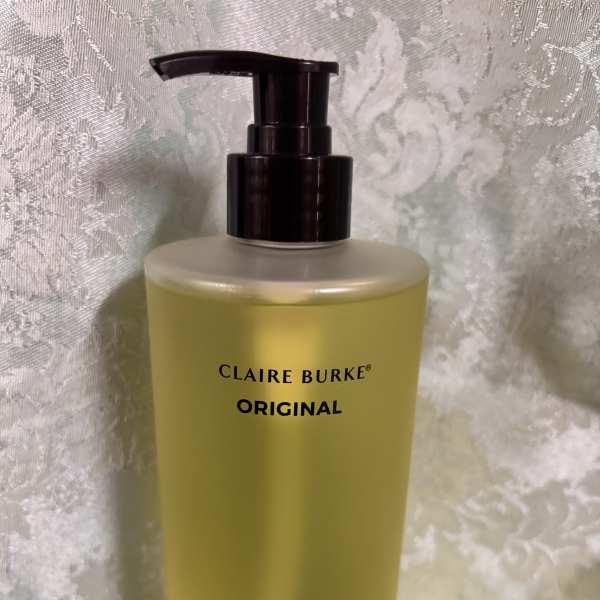 Yellow hand soap bottle with a black pump dispenser