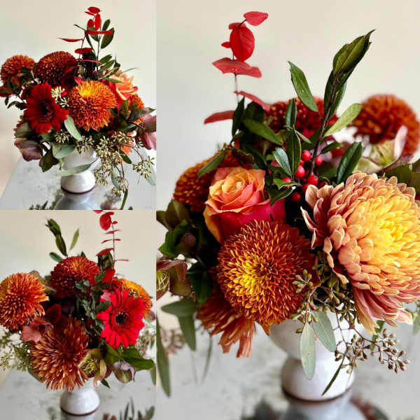 Orange and red mixed bouquet in a white vase