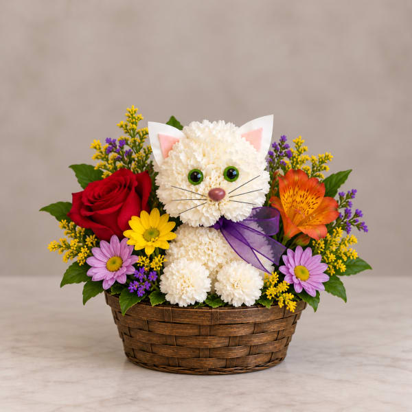Basket arrangement with a cat-shaped white chrysanthemum centerpiece and colorful flowers