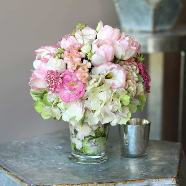 Pink and white bouquet in a clear glass vase