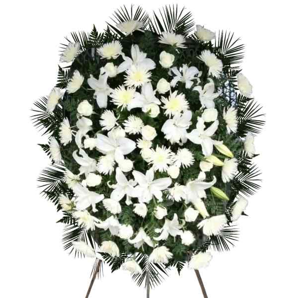 White floral standing spray on an easel