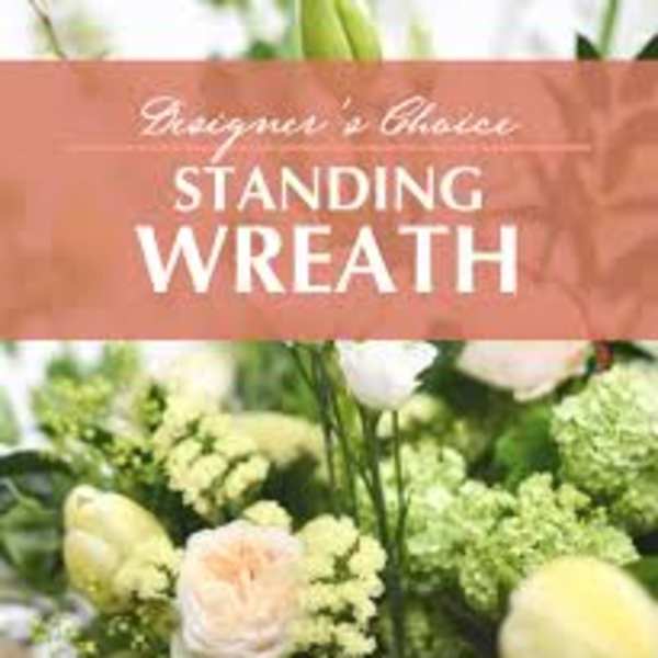 Standing wreath with pale flowers and greenery