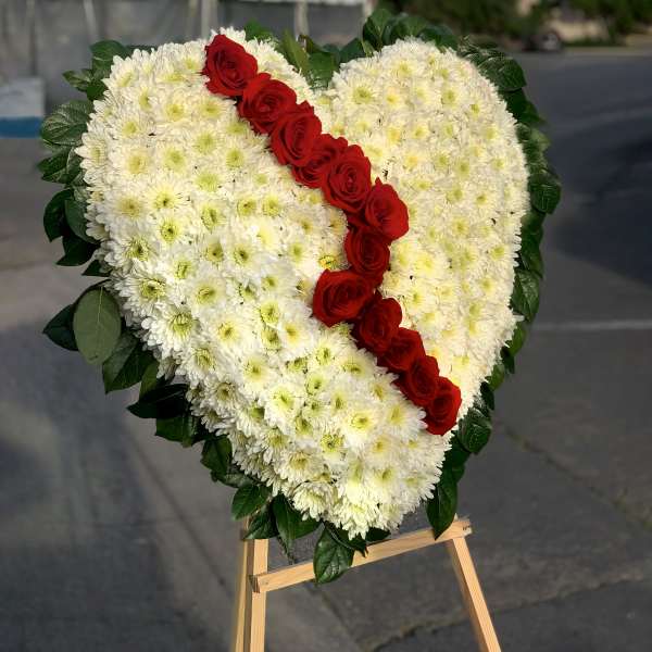 Heart-shaped floral spray with white chrysanthemums and red roses
